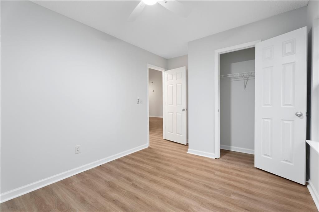 7815 Ridge Top Terrace Douglasville, GA 30134 - Photo 22 of 31 a view of an empty room with wooden floor