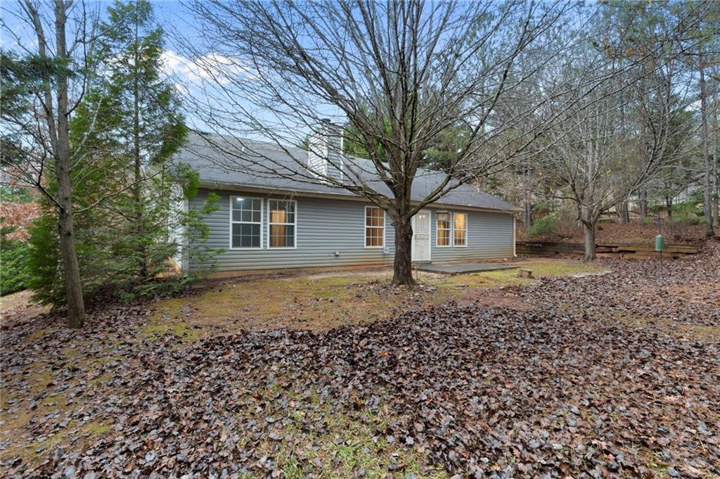 7815 Ridge Top Terrace Douglasville, GA 30134 - Photo 28 of 31 a front view of a house with a garden