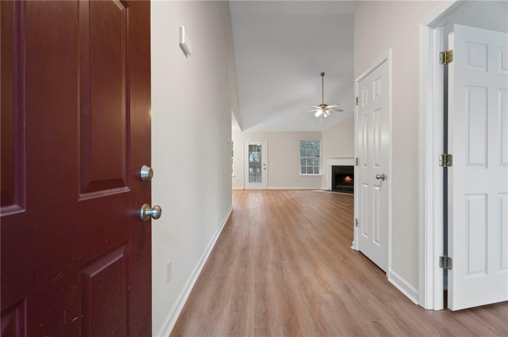 7815 Ridge Top Terrace Douglasville, GA 30134 - Photo 3 of 31 a view of a hallway with wooden floor