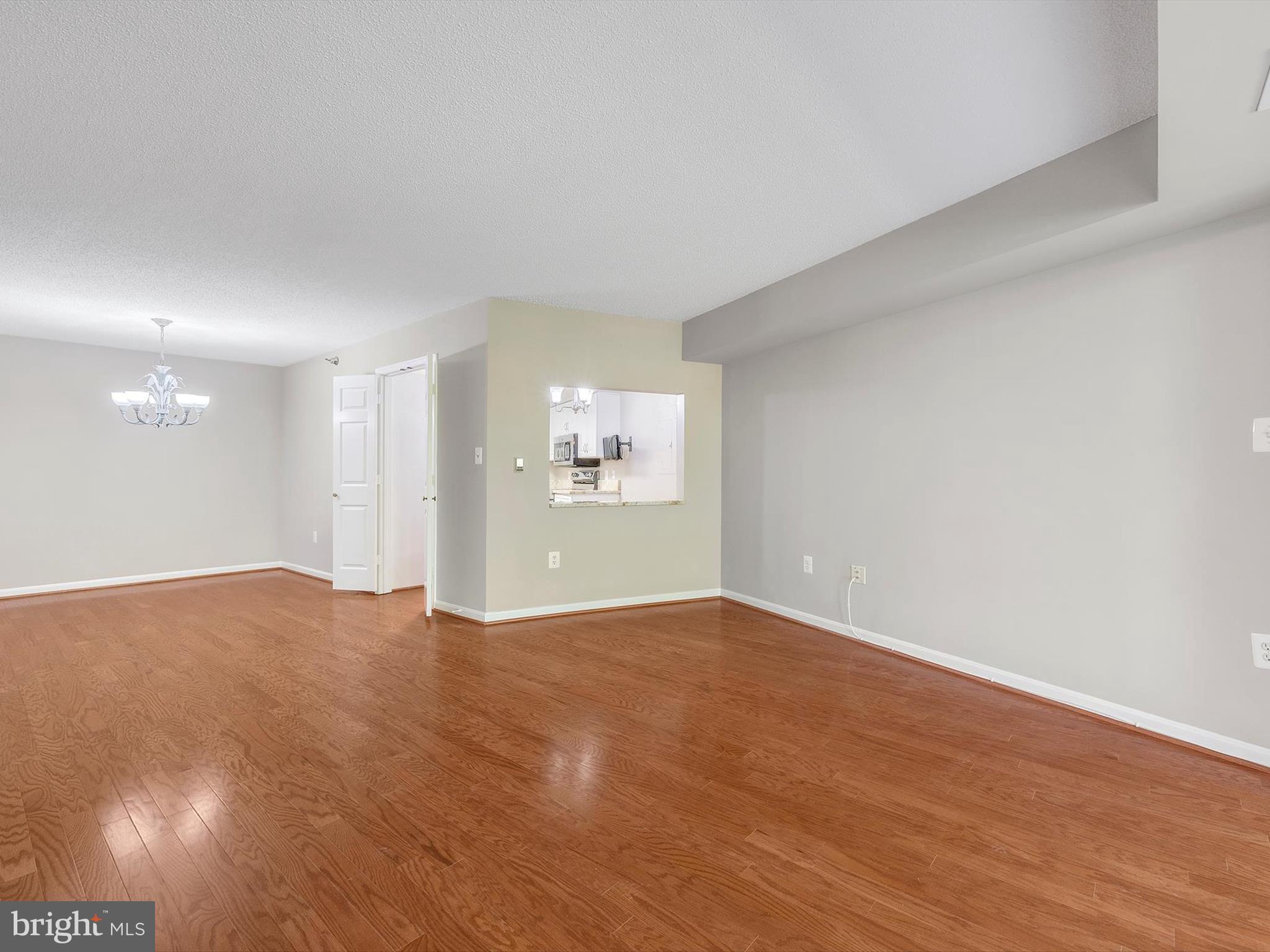 14809 Pennfield Circle, Unit 406 Silver Spring, MD 20906 - Photo 11 of 45 a view of an empty room with a window