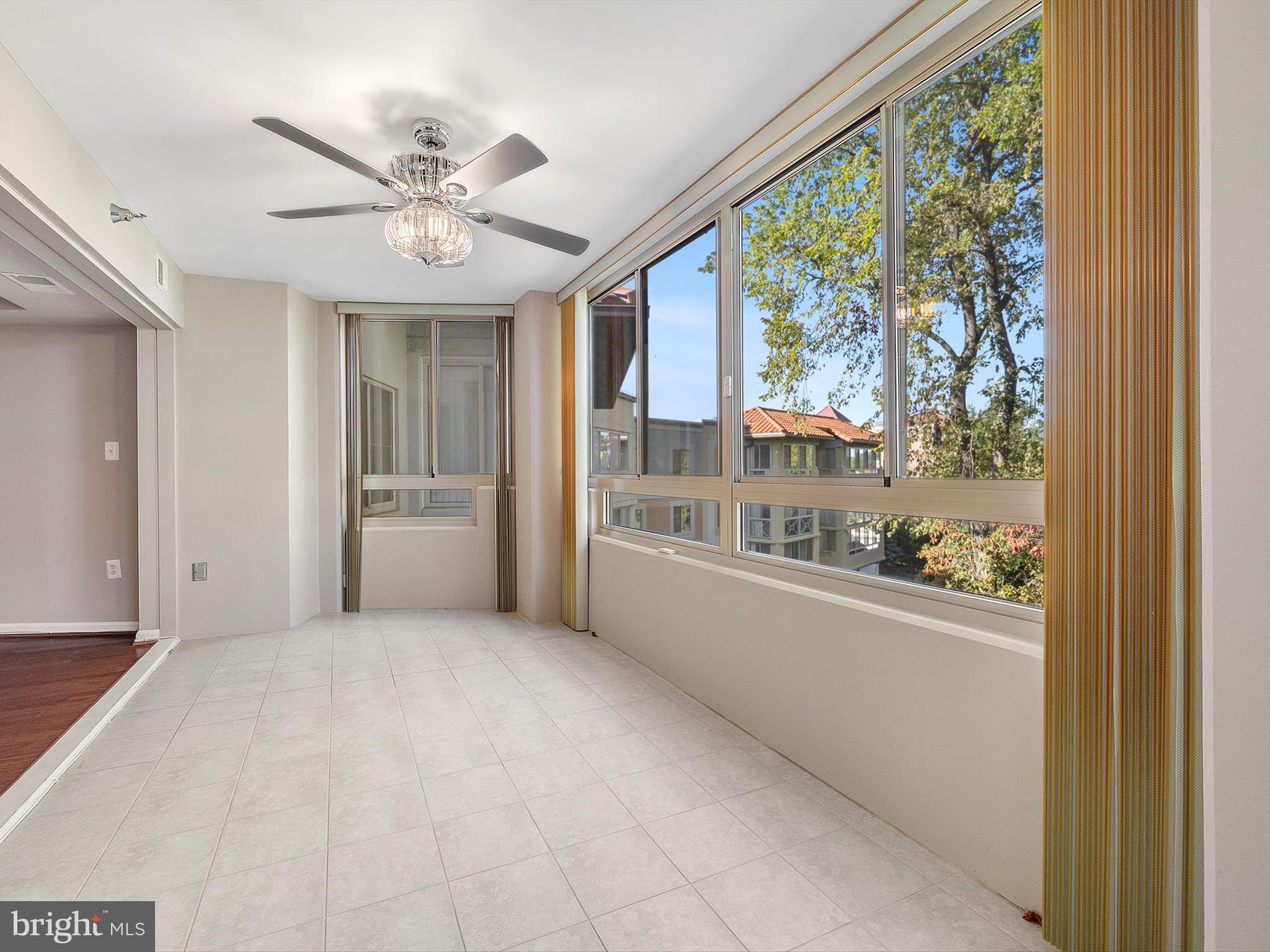 14809 Pennfield Circle, Unit 406 Silver Spring, MD 20906 - Photo 25 of 45 a view of an empty room with a window