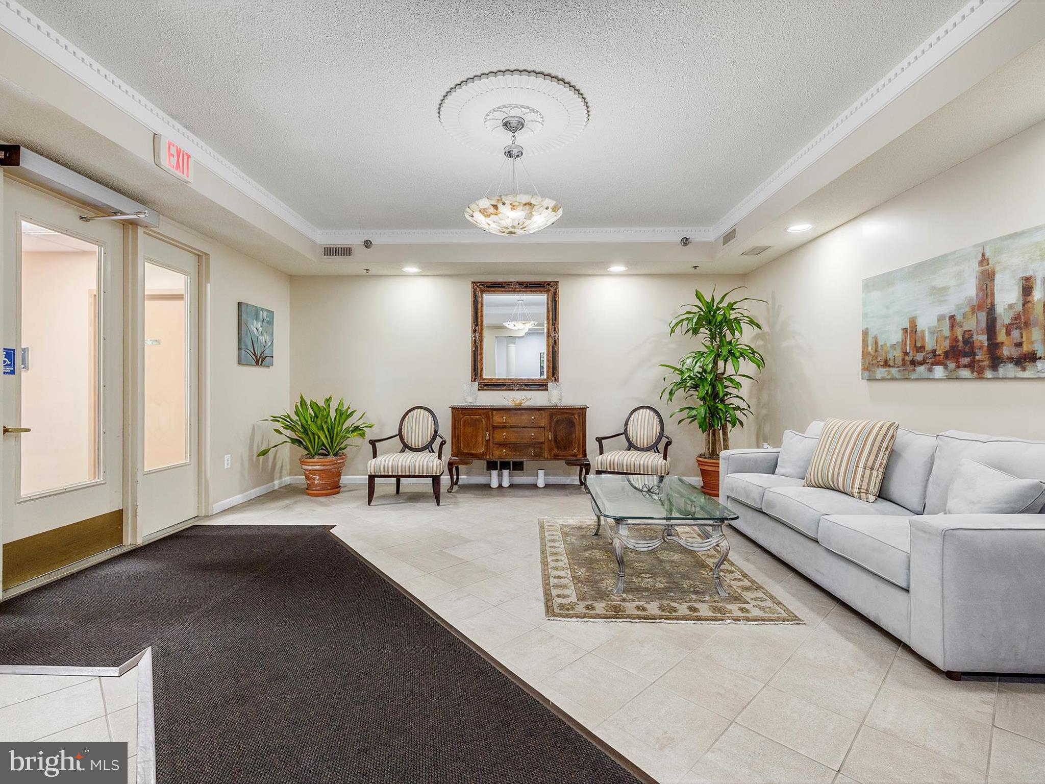 14809 Pennfield Circle, Unit 406 Silver Spring, MD 20906 - Photo 3 of 45 a living room with furniture flowerpot and a chandelier