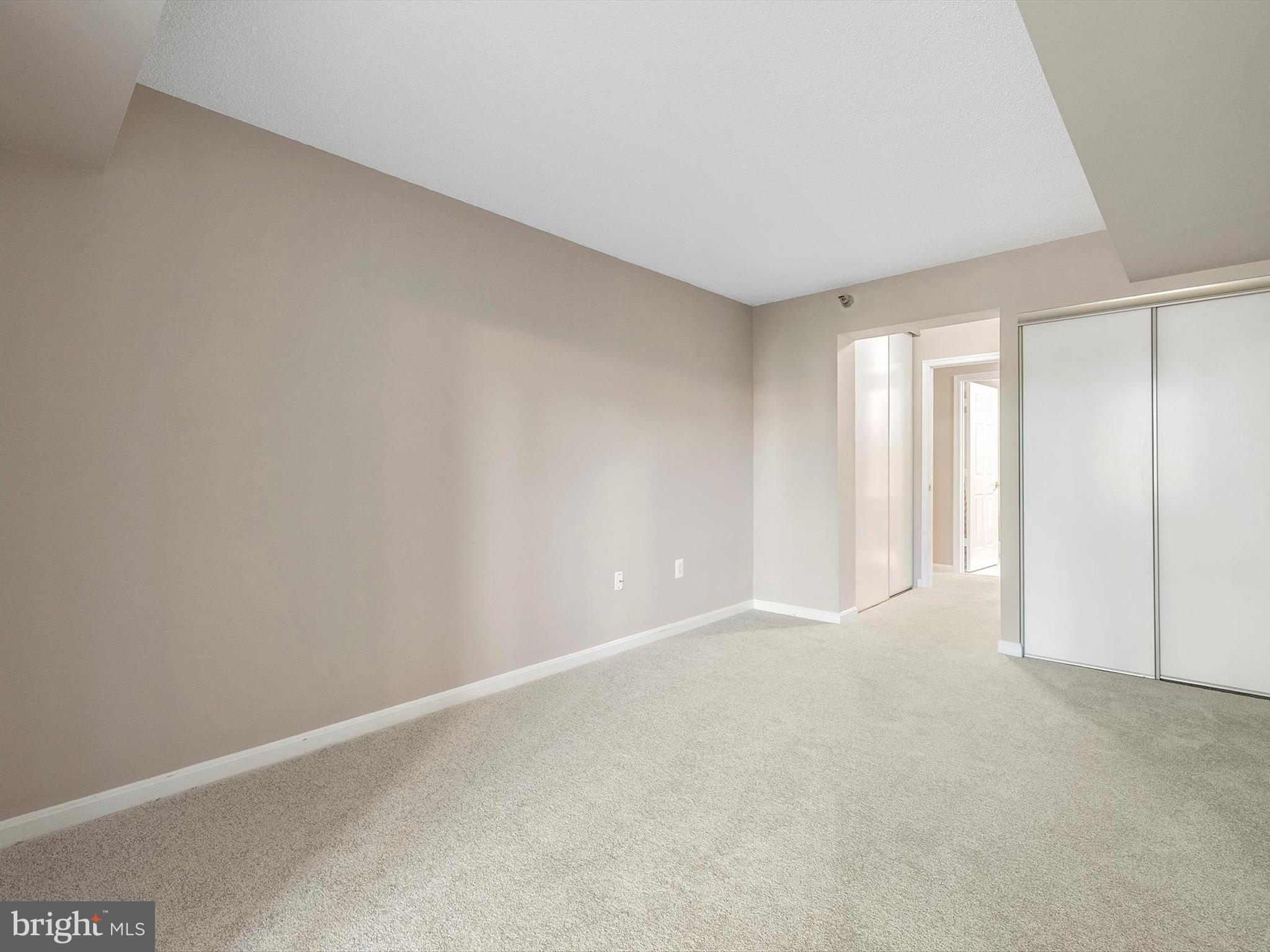 14809 Pennfield Circle, Unit 406 Silver Spring, MD 20906 - Photo 33 of 45 a view of an empty room and a window