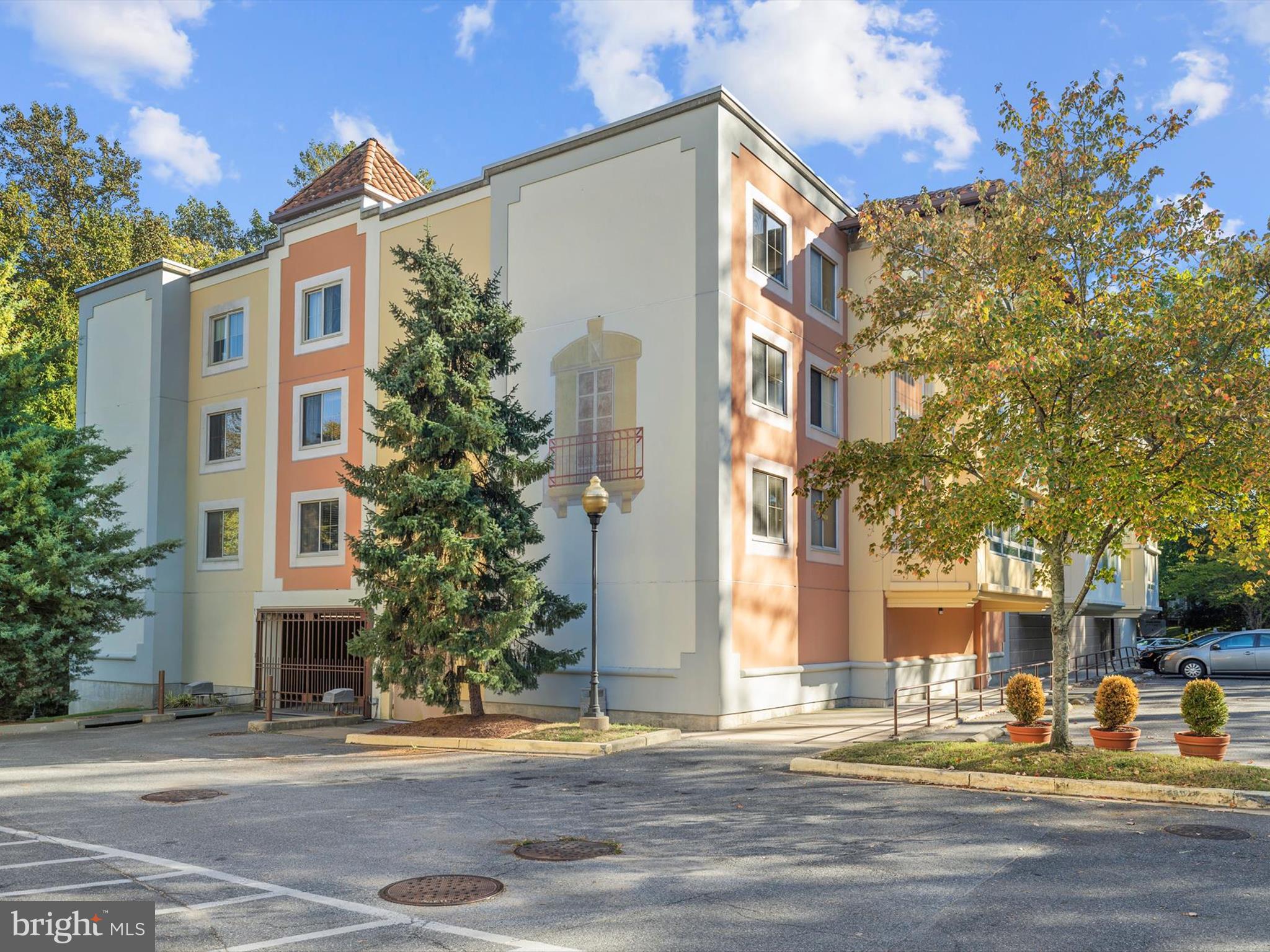 14809 Pennfield Circle, Unit 406 Silver Spring, MD 20906 - Photo 43 of 45 a front view of a building with street view