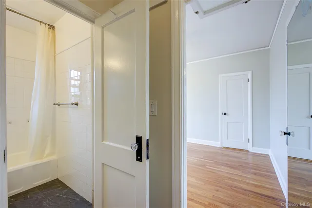 a view of a bathroom from a hallway