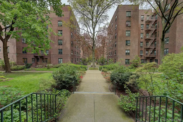 a sign that is sitting in front of flowers