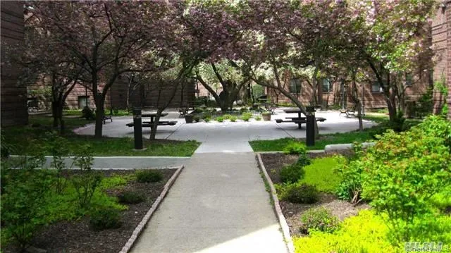 a bathroom with a bathtub sink vanity and mirror