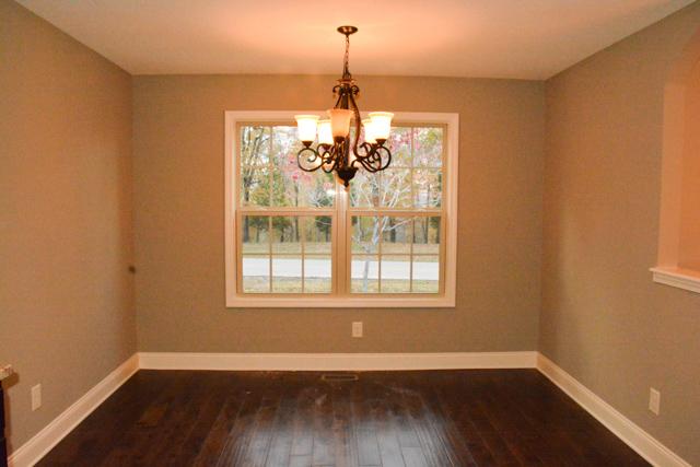 1023 Barnhill Road Clarksville, TN 37043 - Photo 8 of 18 a view of a room with wooden floor chandelier and windows
