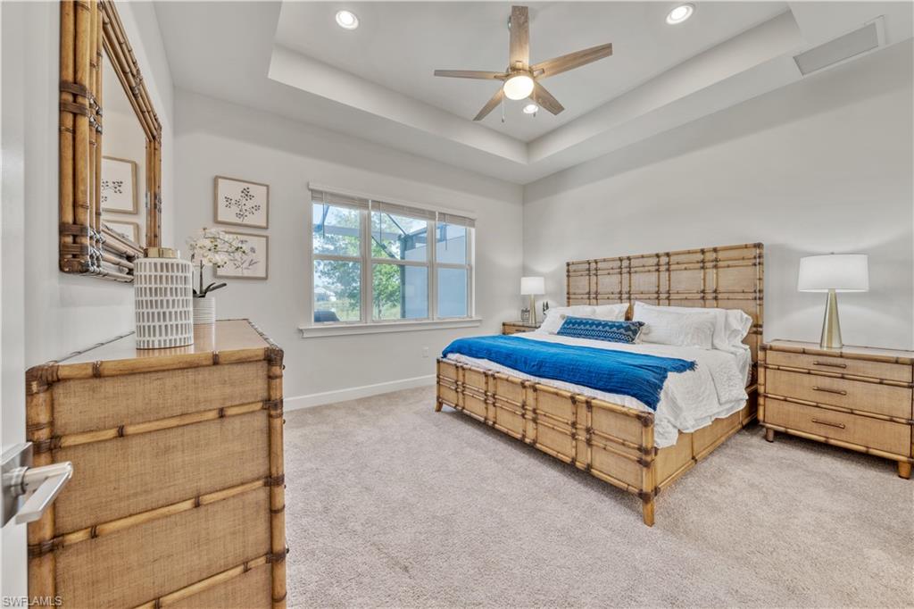 6421 Carnival Road Naples, FL 34113 - Photo 16 of 28 a bedroom with a bed and window