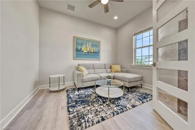 a living room with furniture and a rug