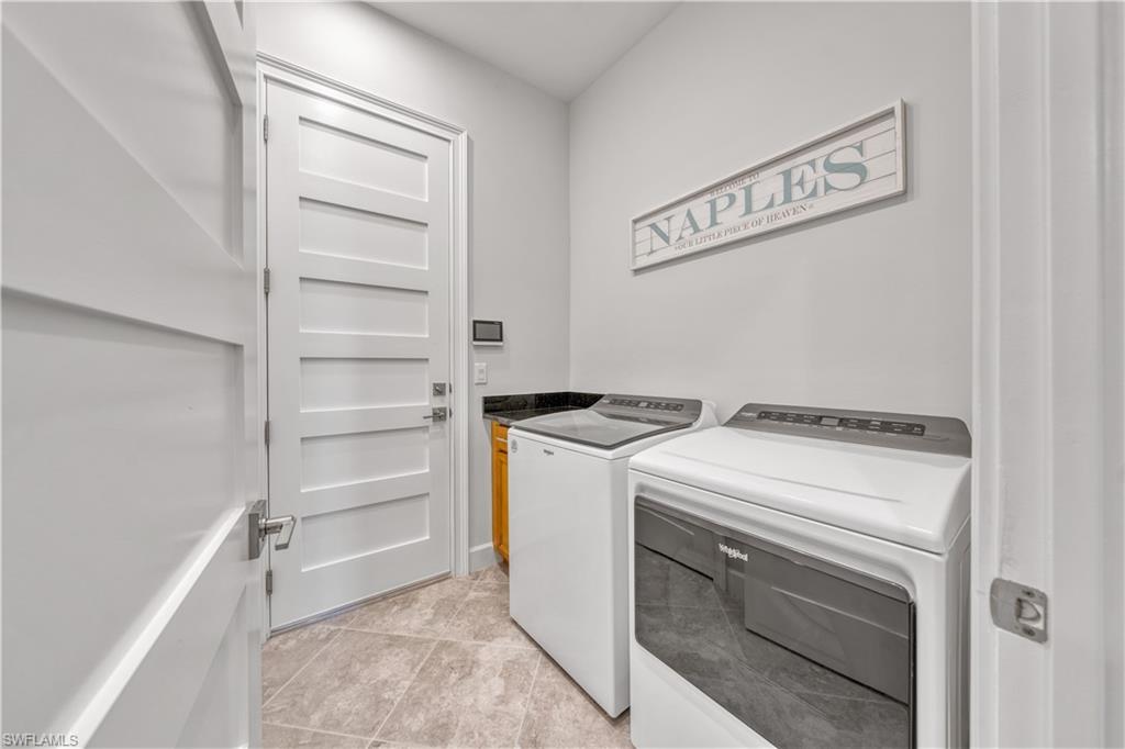 6421 Carnival Road Naples, FL 34113 - Photo 24 of 28 a utility room with washer and dryer