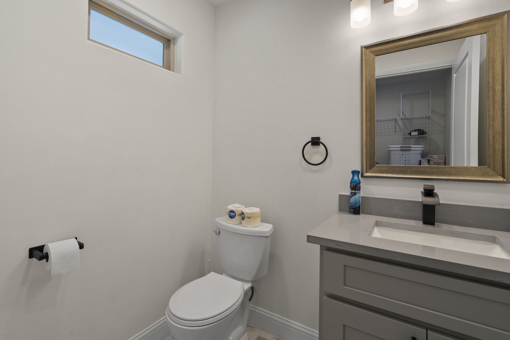 2402 Chimney Rock Road Houston, TX 77057 - Photo 23 of 36 Well-appointed half bath featuring a modern vanity with sleek countertops, updated fixtures, and a clean, functional design.