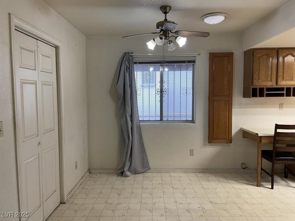 3530 North Pecos Road Las Vegas, NV 89115 - Photo 12 of 46 Dining space with baseboards, ceiling fan, and light floors