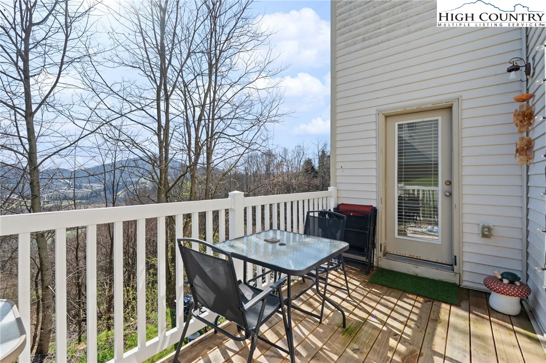 166 Azor Court, Unit 2A Boone, NC 28607 - Photo 11 of 38 a view of a chairs in wooden deck