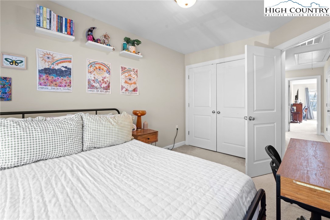 166 Azor Court, Unit 2A Boone, NC 28607 - Photo 19 of 38 a bedroom with a bed and wooden floor