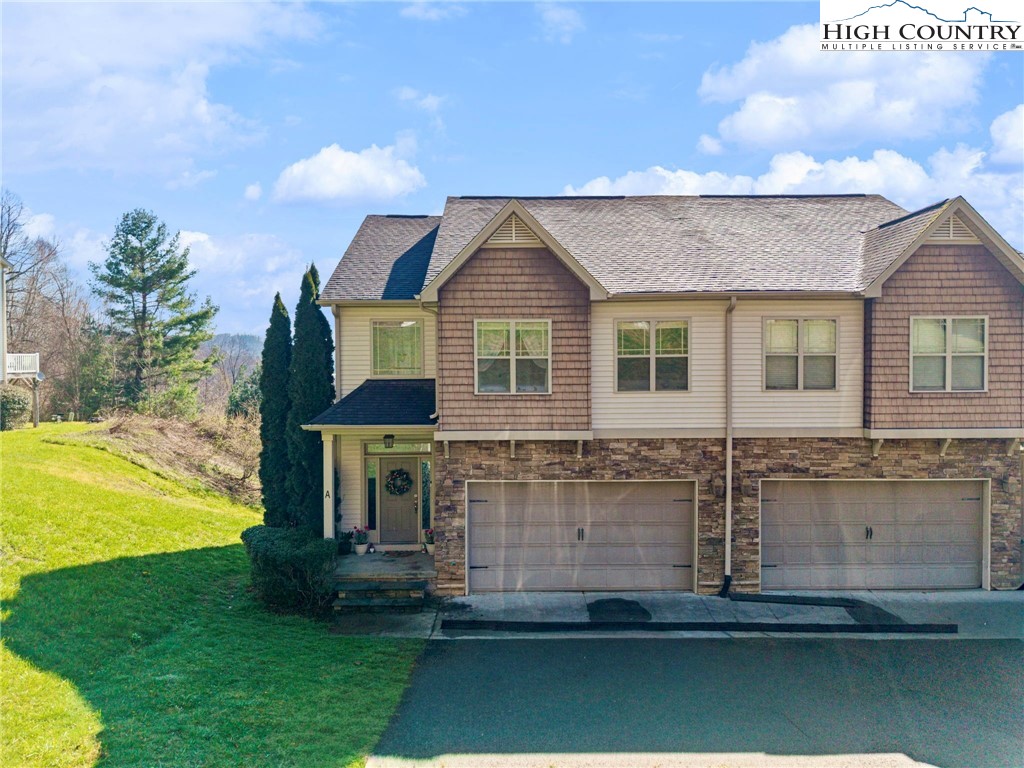 166 Azor Court, Unit 2A Boone, NC 28607 - Photo 35 of 38 a front view of a house with a yard