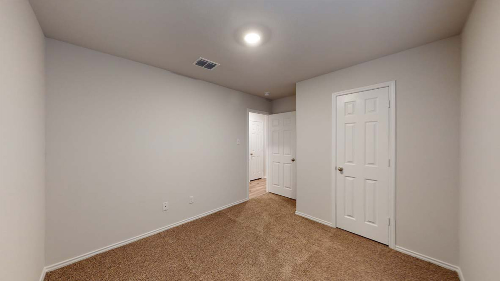 1418 Victory Rnch Trail Killeen, TX 76549 - Photo 15 of 22 A well-lit room with fresh carpeting and white paneled doors awaits your personal touch.