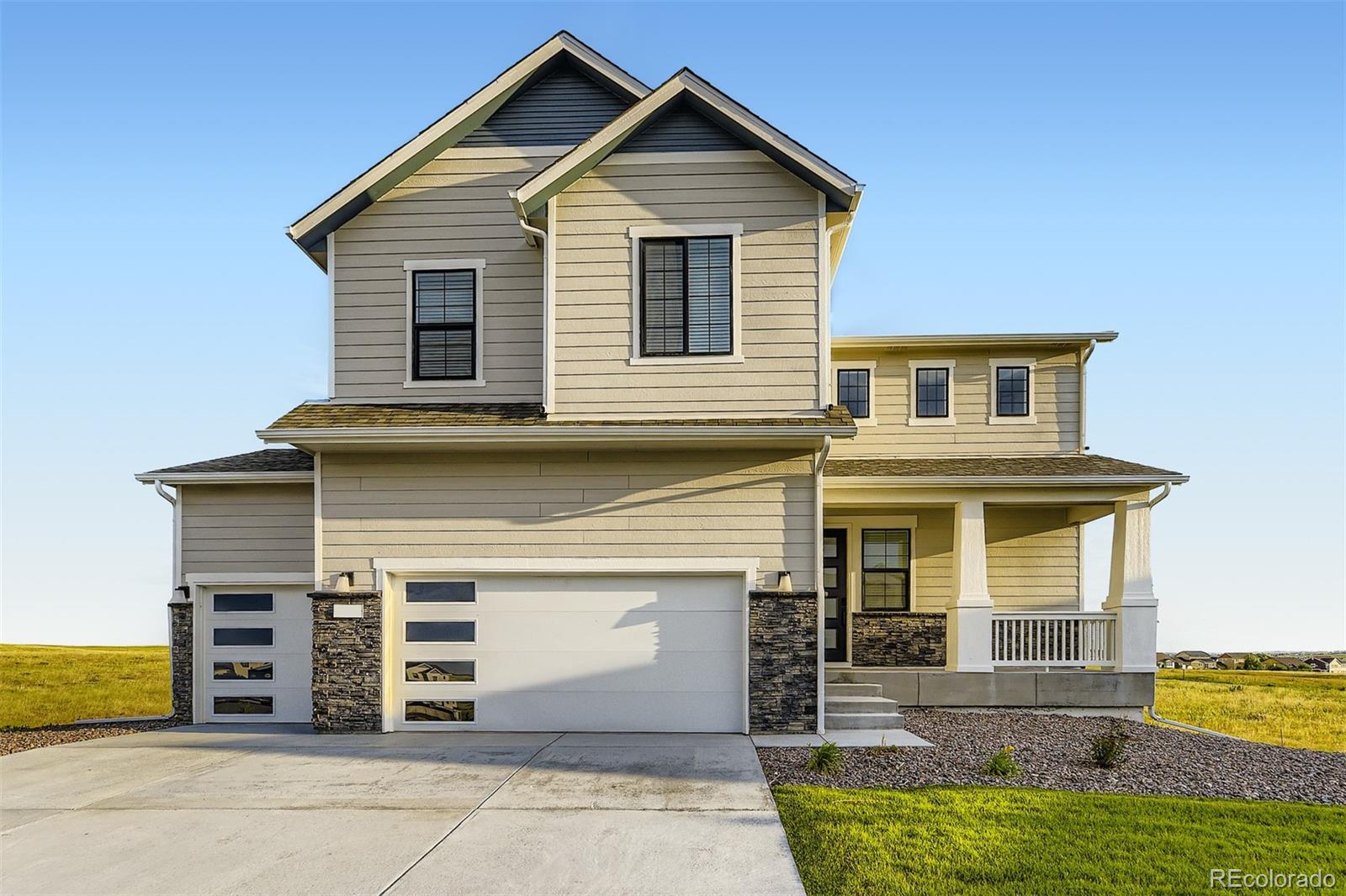 42972 Colonial Trail Elizabeth, CO 80107 - Photo 1 of 27 a front view of a house with a yard
