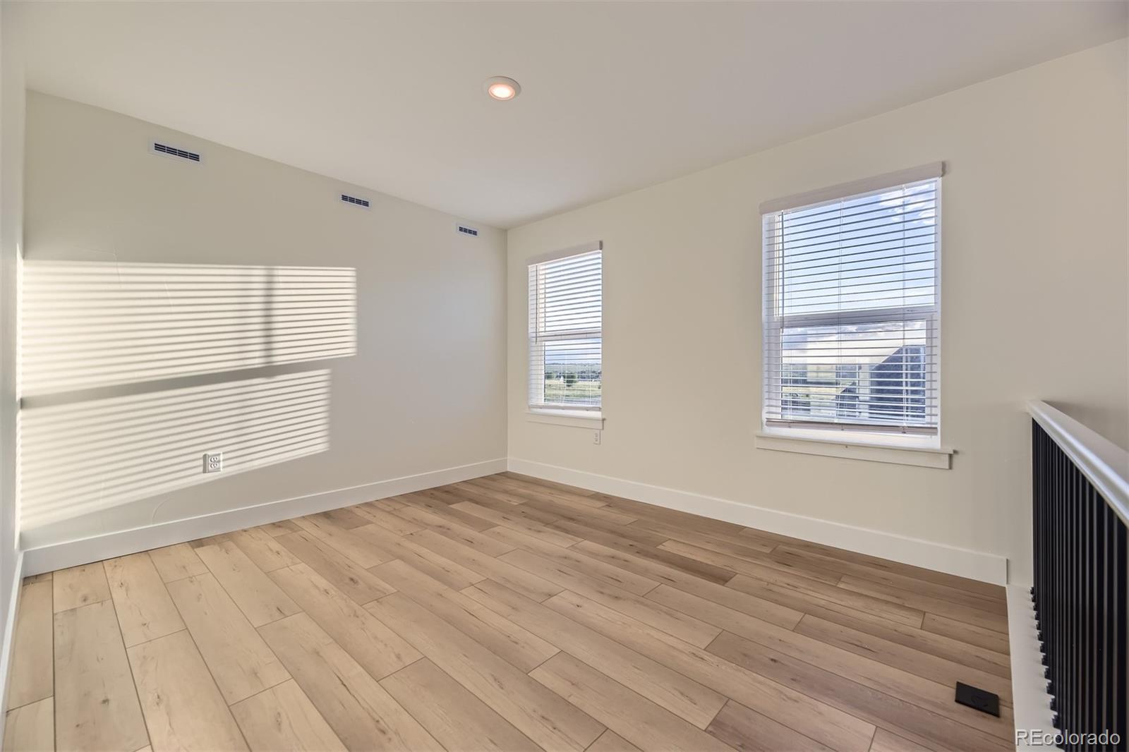 42972 Colonial Trail Elizabeth, CO 80107 - Photo 15 of 27 a view of an empty room with wooden floor and a window