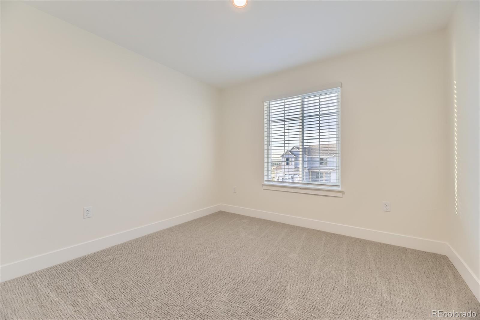 42972 Colonial Trail Elizabeth, CO 80107 - Photo 18 of 27 an empty room with a window