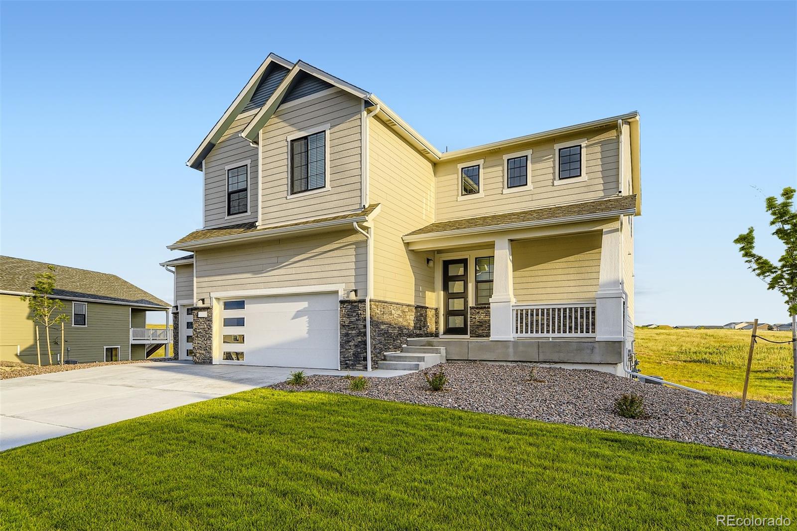 42972 Colonial Trail Elizabeth, CO 80107 - Photo 2 of 27 a front view of a house with a yard