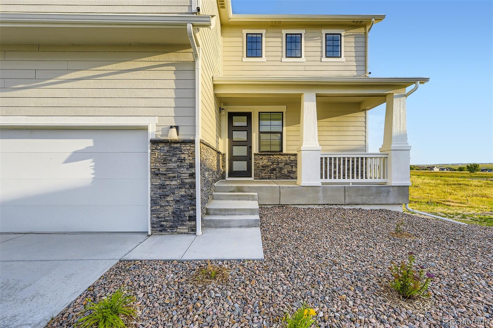 42972 Colonial Trail Elizabeth, CO 80107 - Photo 3 of 27 a front view of a house with garden