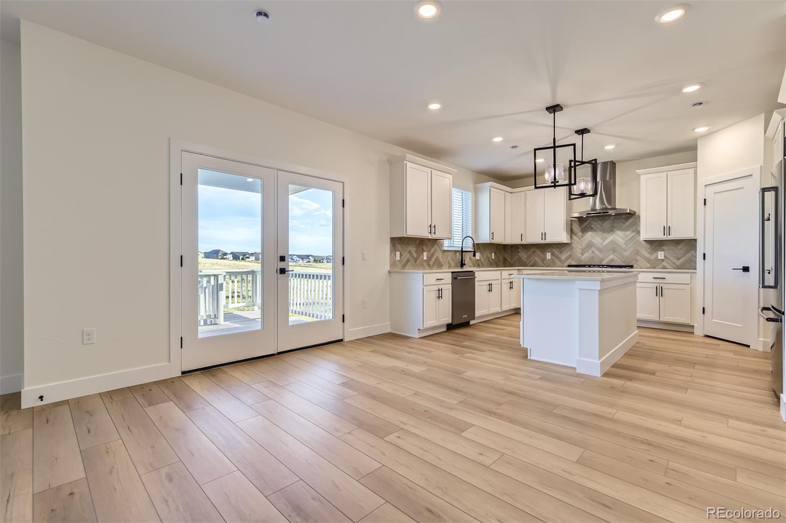 42972 Colonial Trail Elizabeth, CO 80107 - Photo 7 of 27 a view of kitchen with granite countertop window and stainless steel appliances
