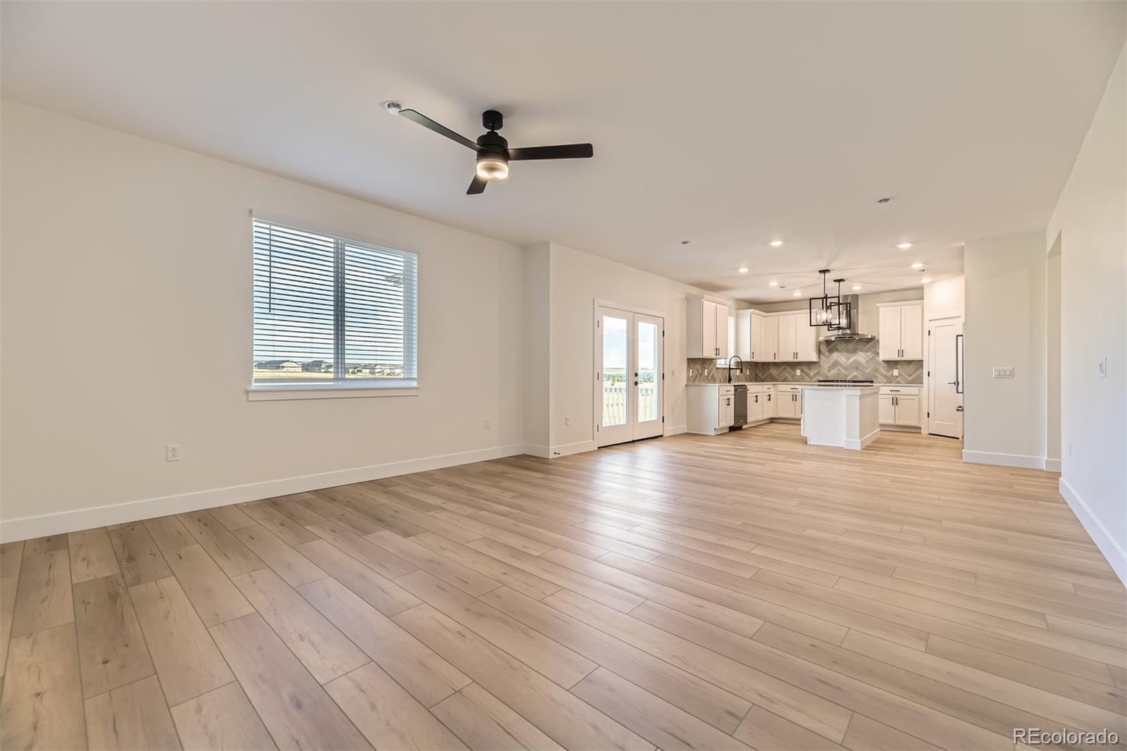 42972 Colonial Trail Elizabeth, CO 80107 - Photo 8 of 27 a view of empty room with wooden floor and window