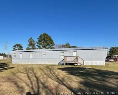 a view of a swimming pool with a yard