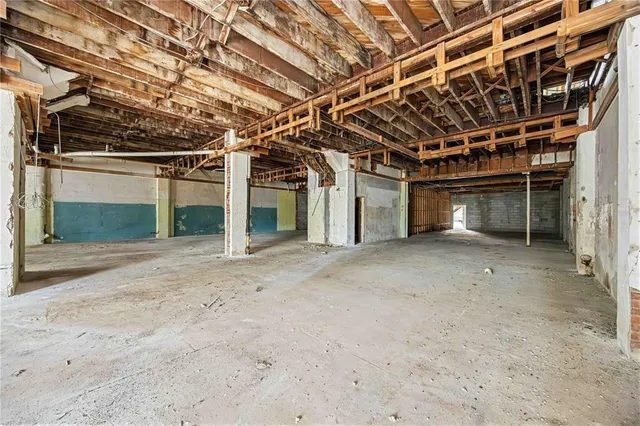 a view of a room with wooden walls