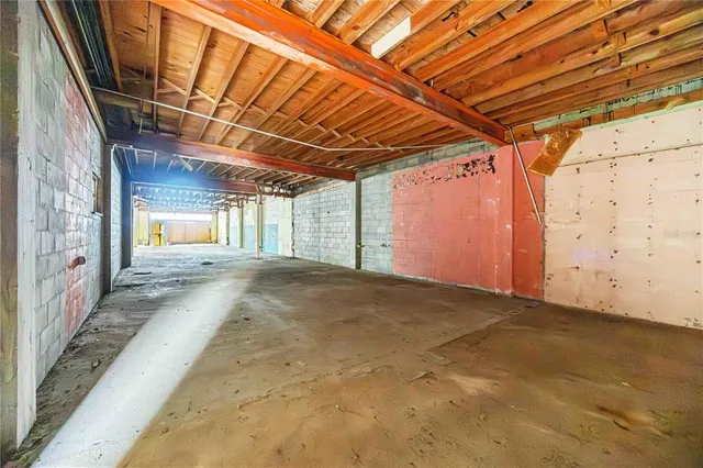 a view of a porch with wooden floor and iron stairs