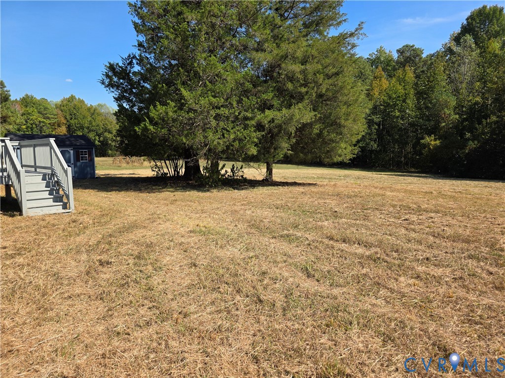 7613 Squirrel Level Road Petersburg, VA 23805 - Photo 9 of 30 Expansive outdoor area featuring a large central t