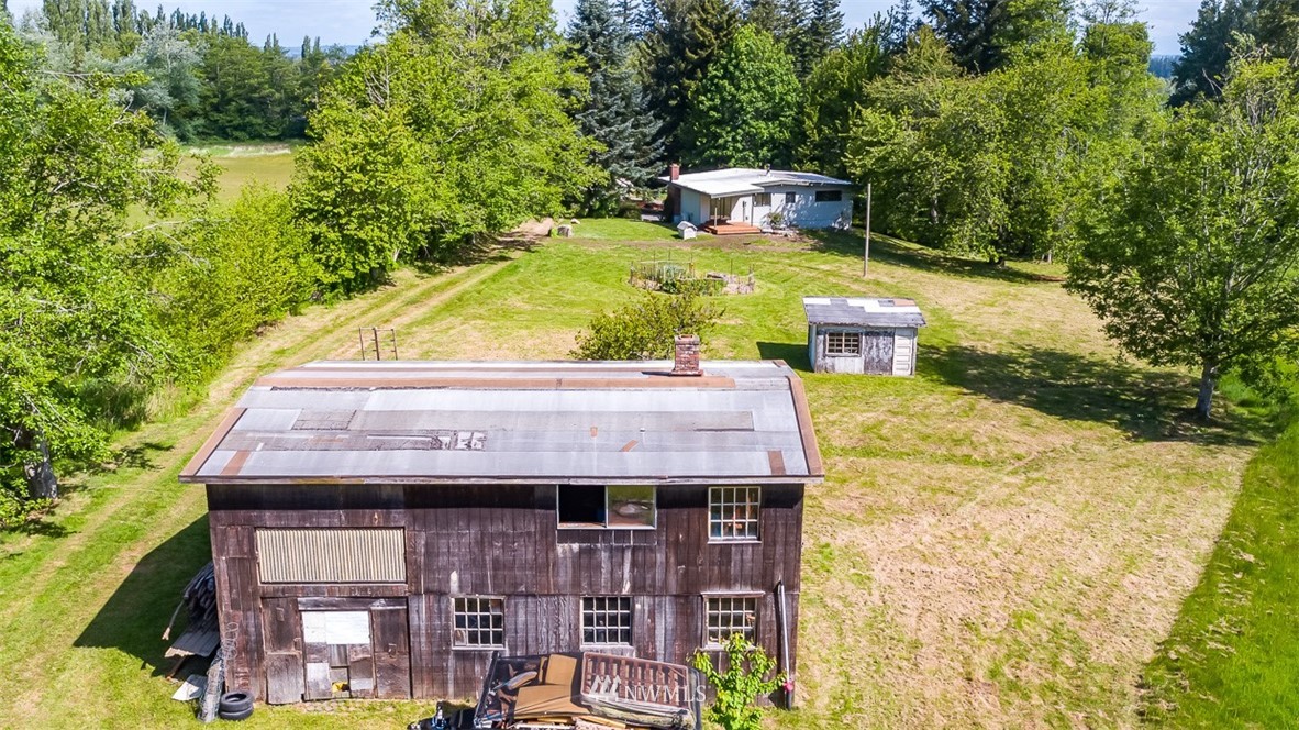 3235 Bay Road Ferndale, WA 98248 - Photo 40 of 40 an aerial view of a house with swimming pool and large trees