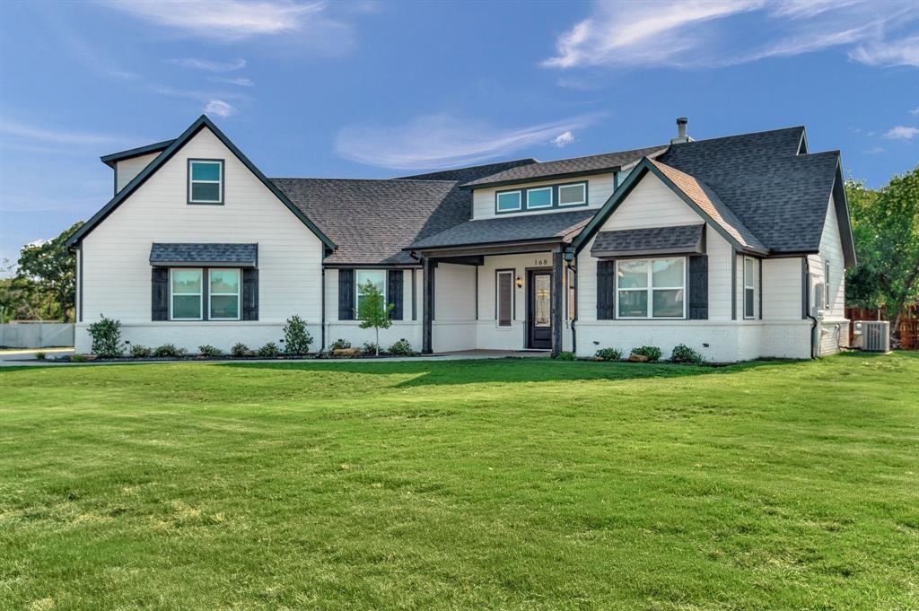 168 Lakeview Circle Pilot Point, TX 76258 - Photo 1 of 1 a front view of a house with a garden
