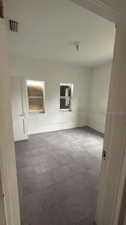a view of an empty room with a window