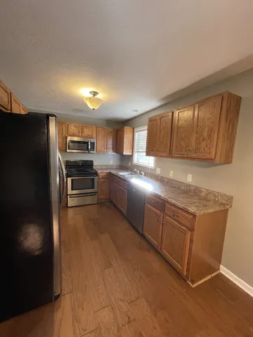 an empty room with a empty space and windows