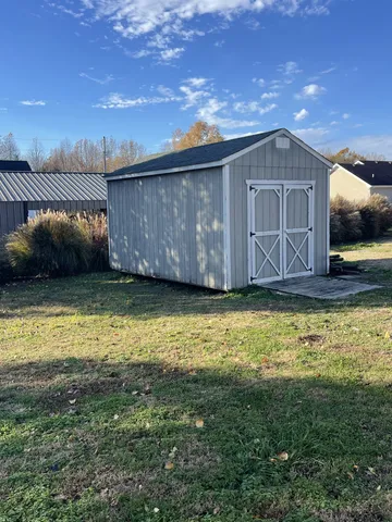 a view of a backyard of the house