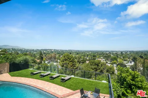 a view of a swimming pool and lake