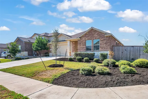 a house view with a garden space