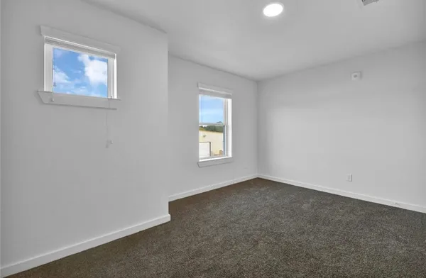 an empty room with windows