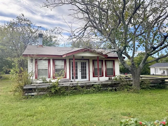 a view of a garden with an outdoor space