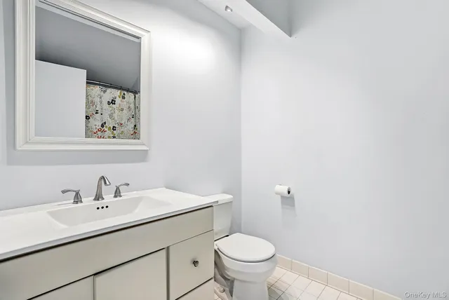 a bedroom with a bed a bookshelf a desk and chair with the wooden floor