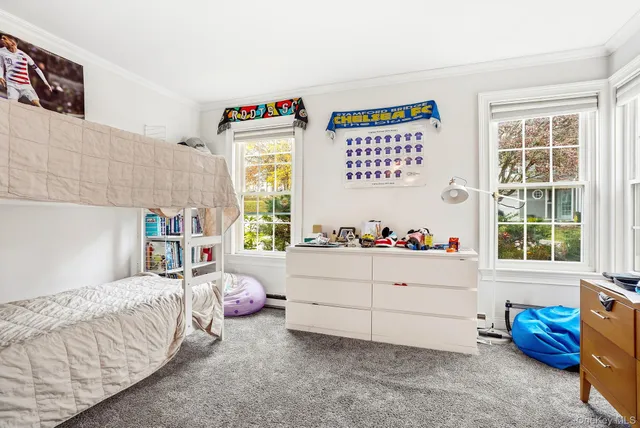 a bathroom with a glass shower door and a sink