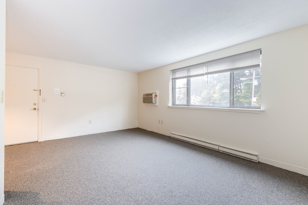 71 Nicholas Road, Unit H Framingham, MA 01701 - Photo 12 of 29 an empty room with a window