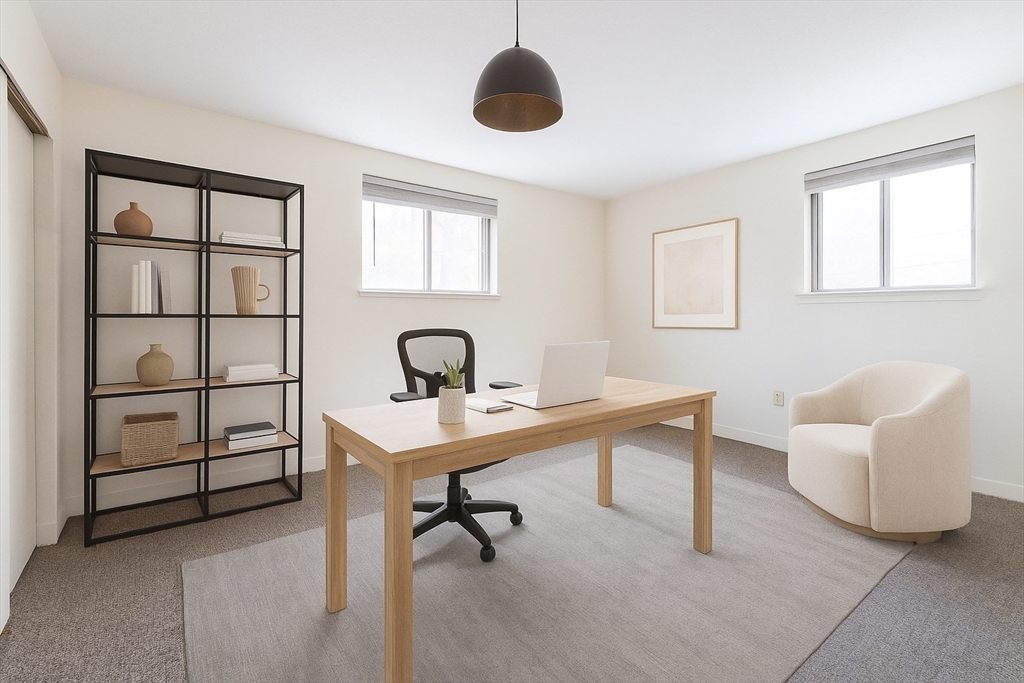 71 Nicholas Road, Unit H Framingham, MA 01701 - Photo 21 of 29 a view of a workspace with furniture and a window