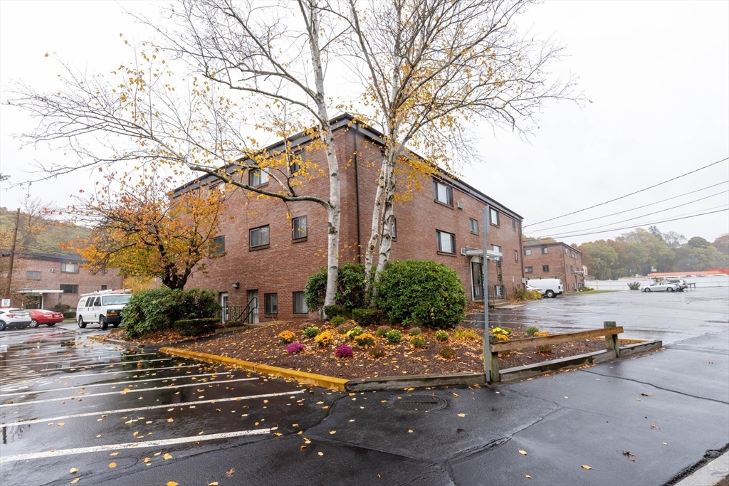 71 Nicholas Road, Unit H Framingham, MA 01701 - Photo 23 of 29 a view of a street with a building on the road