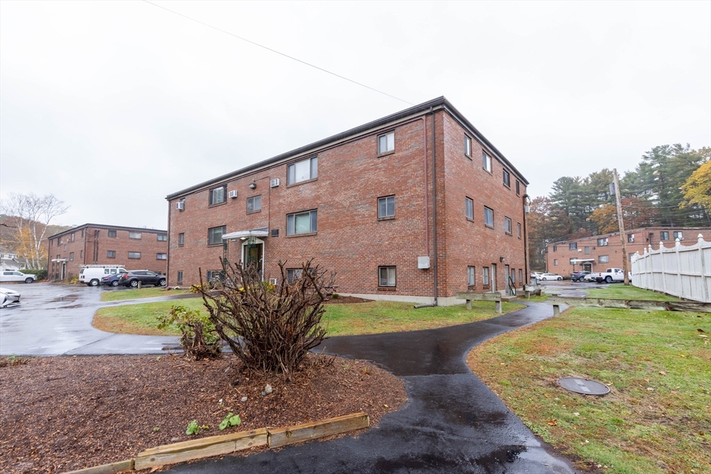 71 Nicholas Road, Unit H Framingham, MA 01701 - Photo 24 of 29 a view of a house with a swimming pool