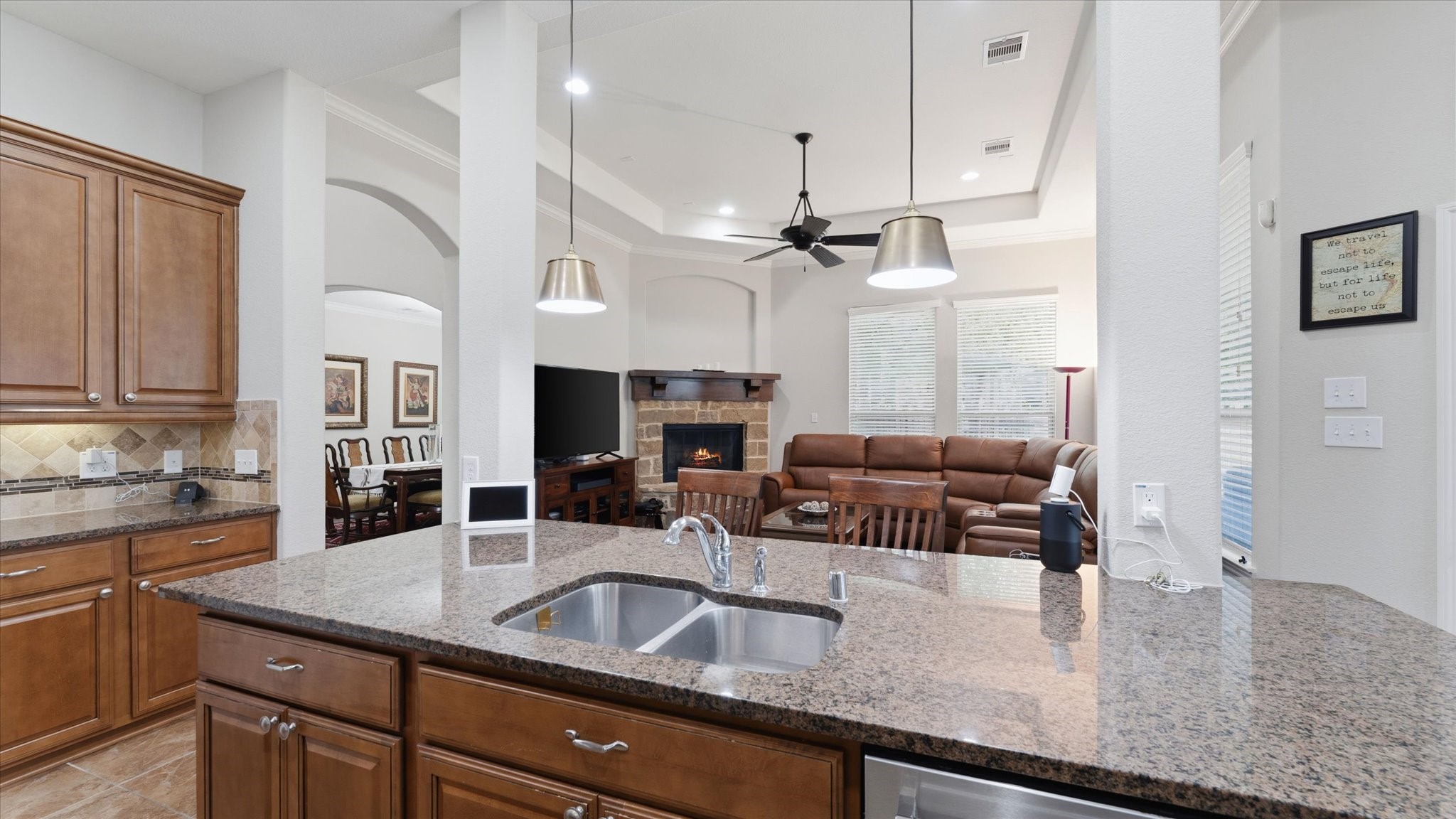 14 Painted Post Place Spring, TX 77389 - Photo 15 of 43 a kitchen with granite countertop a sink a counter top space appliances and cabinets