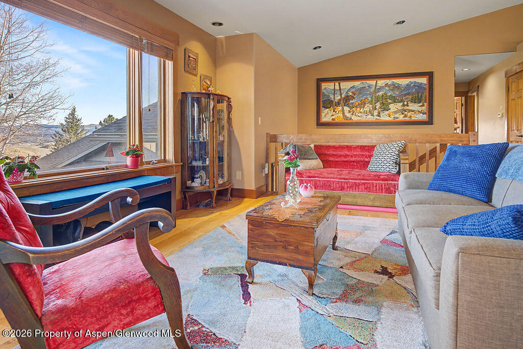 1040 Bryan Way Craig, CO 81625 - Photo 12 of 54 a living room with furniture a rug and a wall painting