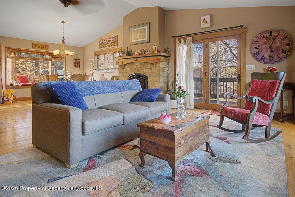 1040 Bryan Way Craig, CO 81625 - Photo 13 of 54 a living room with furniture a large window and a fireplace